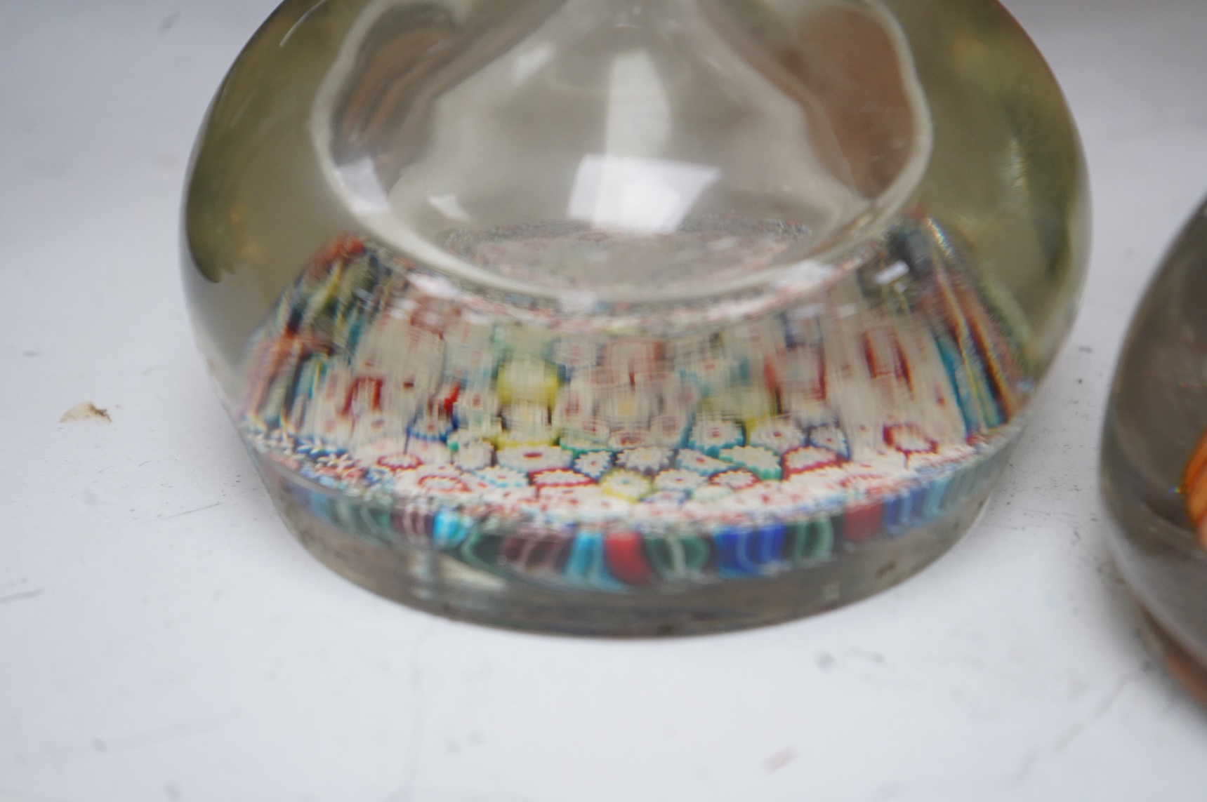 A 19th century millefiori glass inkwell and a similar 20th century inkwell. (2). Largest 16.5cm high